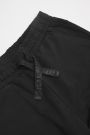 Teplákové kalhoty černé s kapsami na nohavicích 2111469