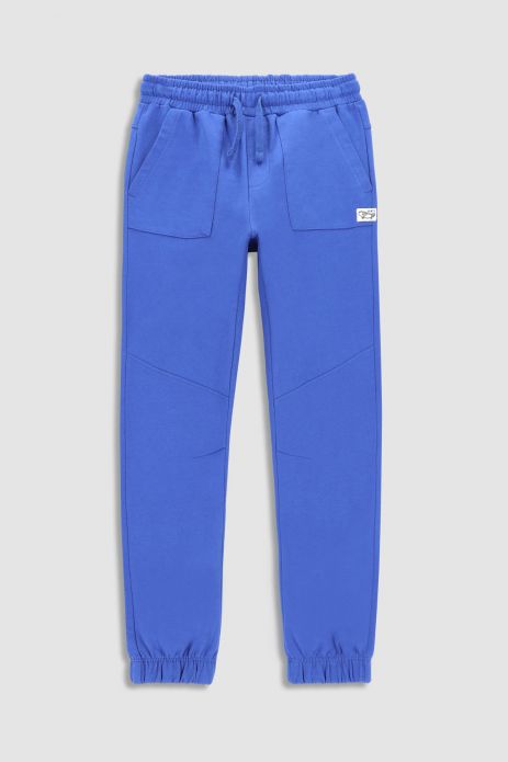 Teplákové kalhoty tmavě modré s kapsami ,střih SLIM