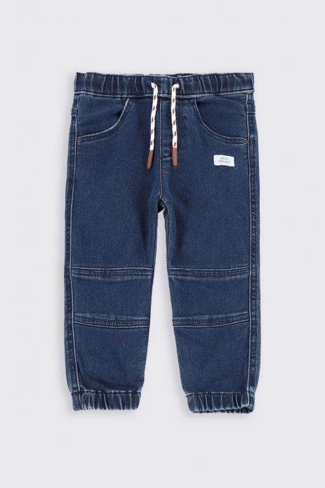 Džínové kalhoty modrýe s prošíváním na nohavicích